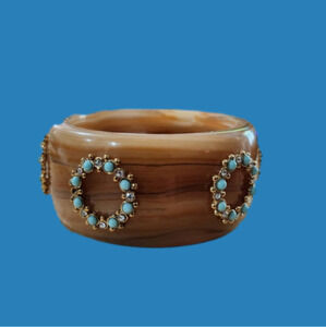 Vintage bracelet. Feels like Bakelite could be heavy lucite.
